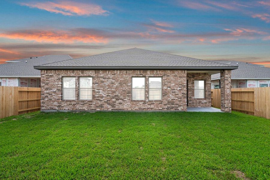 Exterior details and patio area of a home in Windrose Green, Angleton (Image 24).