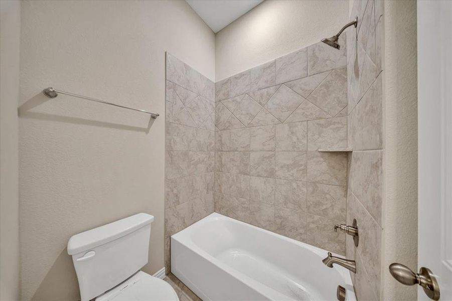 Bathroom with bathtub / shower combination Bathroom with bathtub / shower combination