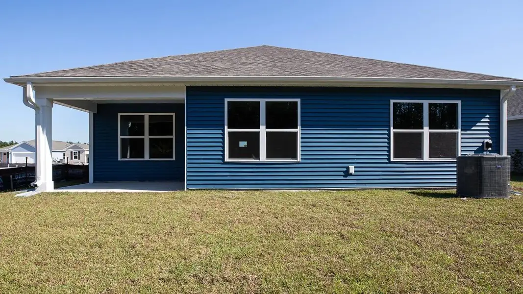 Exterior details and patio area of a home in Cedar Hill Landing, Navassa (Image 3).