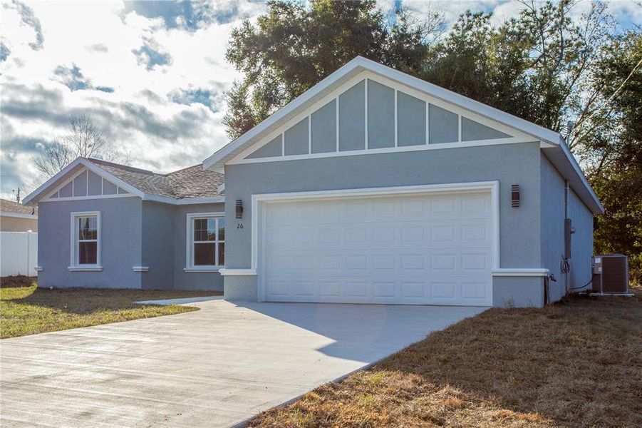 Front exterior of a new home in , Ocala, FL, highlighting curb appeal (Image 16).