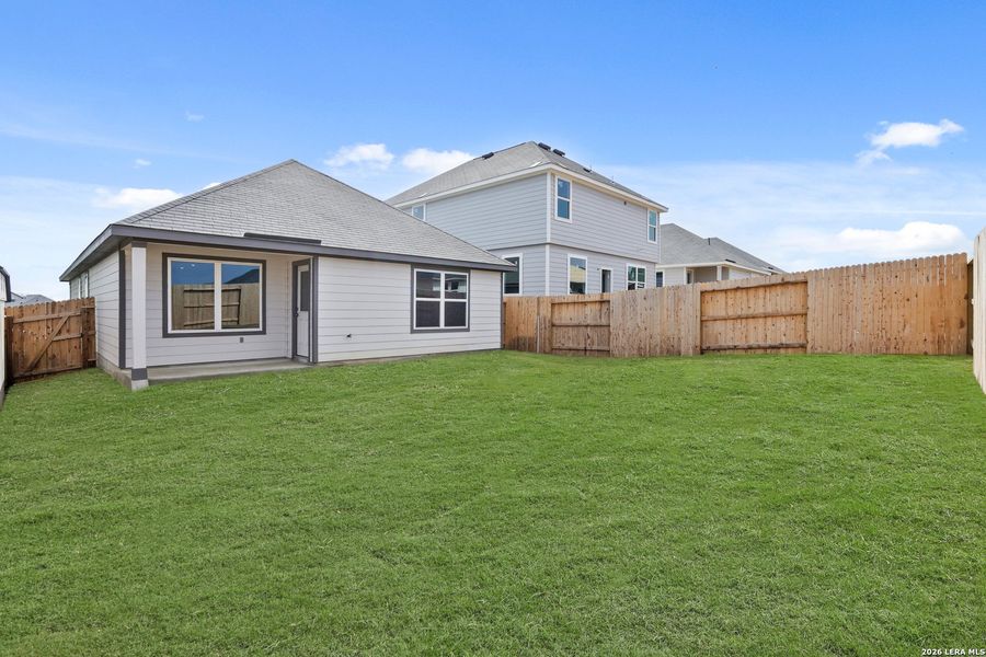Exterior details and patio area of a home in Hickory Ridge, Elmendorf (Image 4).