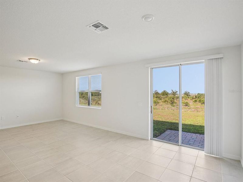 Spacious, unfurnished interior of a new home in The Reserve at Hammock Oaks - Signature Series, Lady Lake (Image 8).