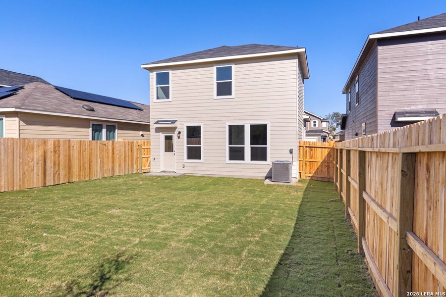 Exterior details and patio area of a home in Spanish Trails Villas, San Antonio (Image 3).