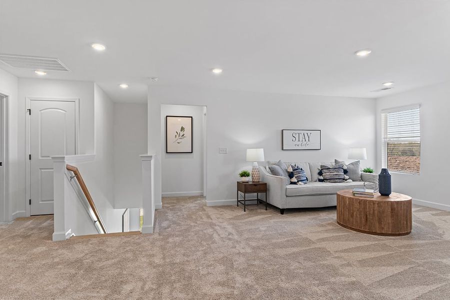 A living room with a couch and a table.