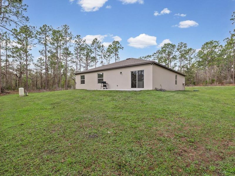 Exterior details and patio area of a home in Royal Highlands, Brooksville (Image 4).
