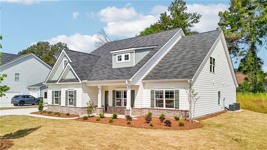Front exterior of a new home in Stephen's Landing, Loganville, GA, highlighting curb appeal (Image 1).
