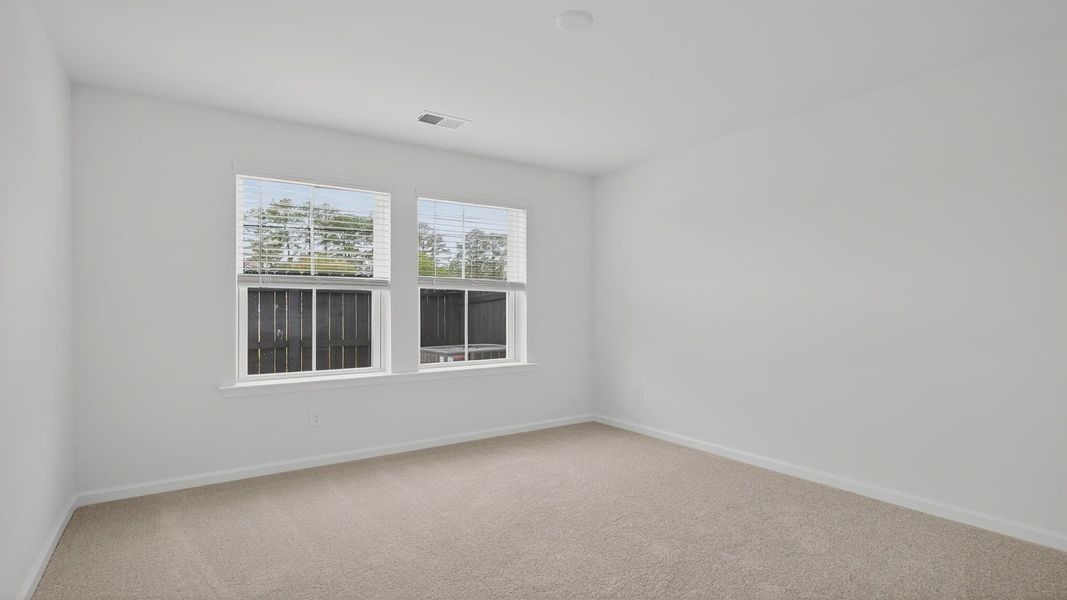 Bedroom with lots of natural light Hayden Floorplan at Clear Springs Townhomes