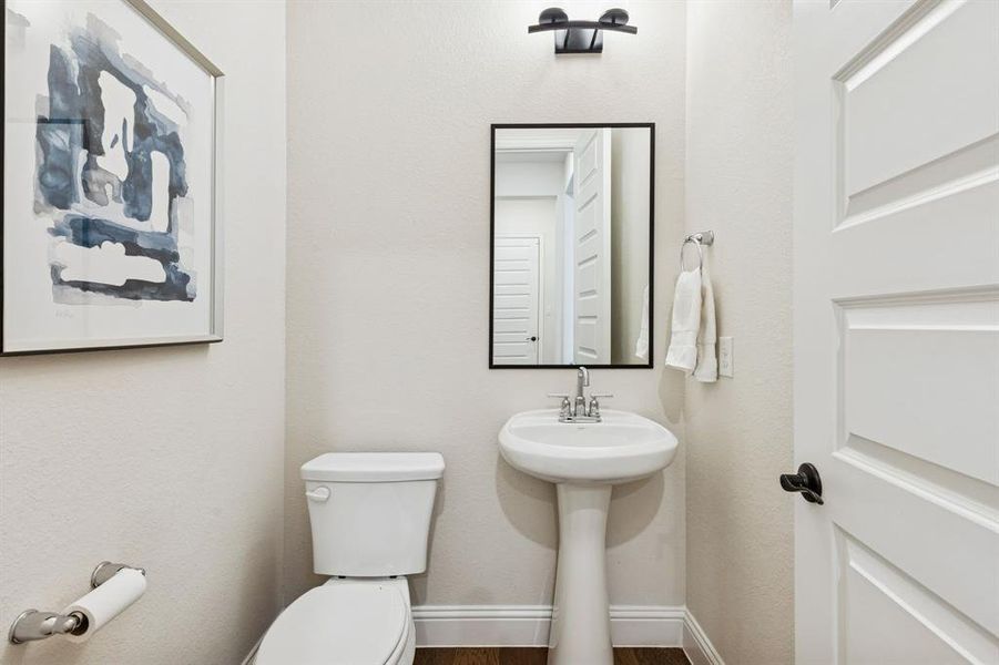 Half bath located near entry and office Half bath located near entry and office