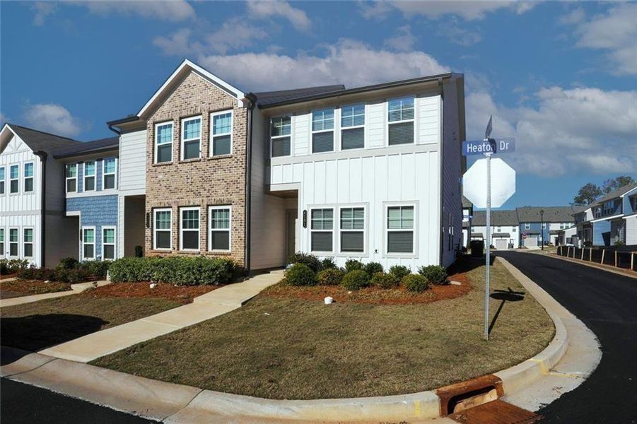Front exterior of a new home in Laurelwood, Douglasville, GA, highlighting curb appeal (Image 24).