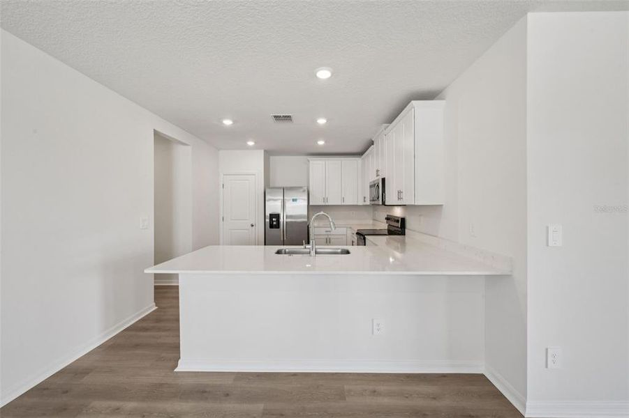 Furnished interior view inside a new home in Ridgehaven - Villas, Ormond Beach (Image 5).
