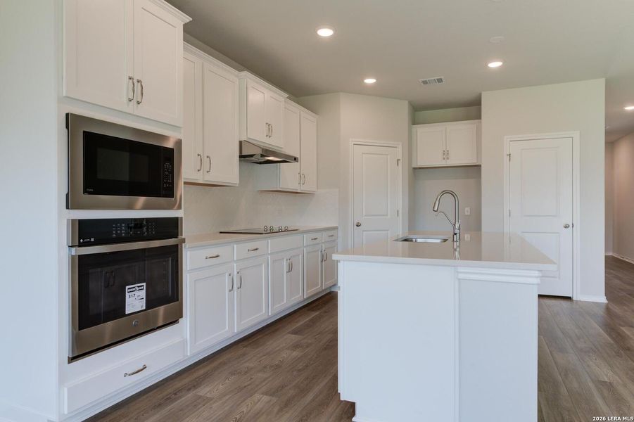 Furnished interior view inside a new home in Nopal Valley, San Antonio (Image 9).