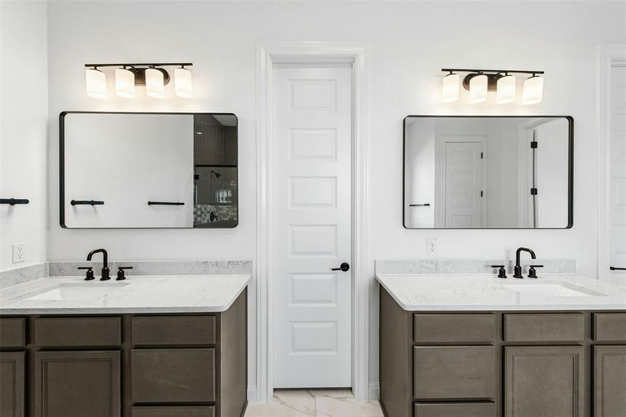 Dual vanity setup featuring white countertops, matte black faucets, and rectangular undermount sinks