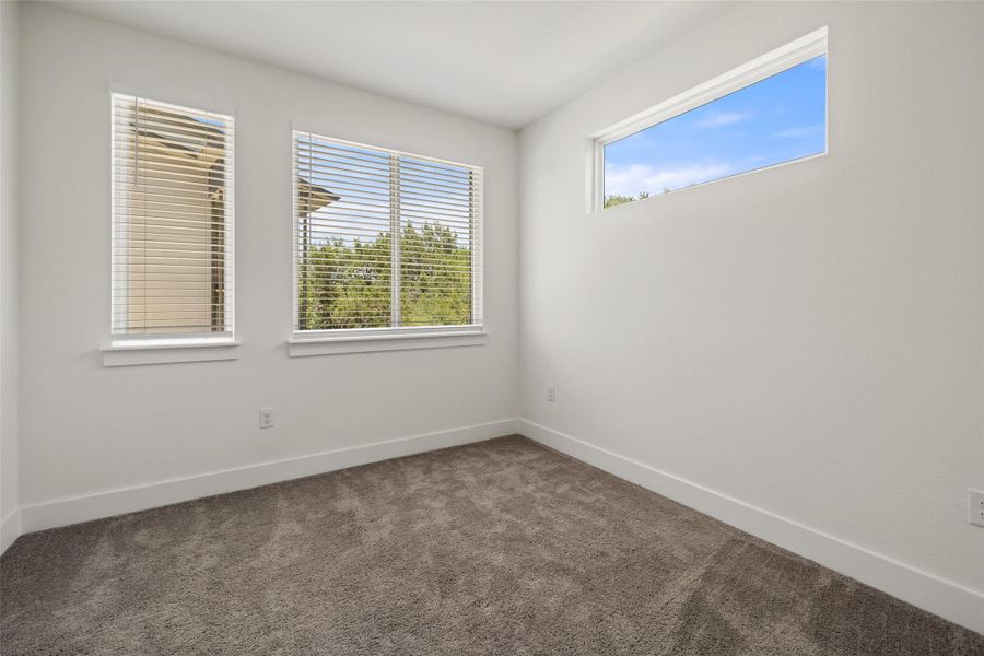 Spare room featuring carpet flooring Spare room featuring carpet flooring