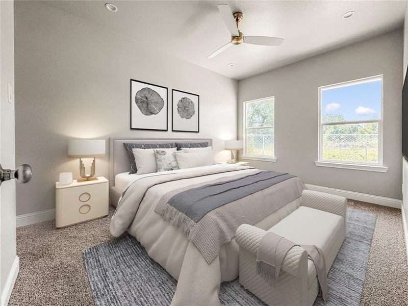 Carpeted bedroom featuring a vaulted ceiling with a ceiling fan, two windows with natural light, and recessed lighting Carpeted bedroom featuring a vaulted ceiling with a ceiling fan, two windows with natural light, and recessed lighting