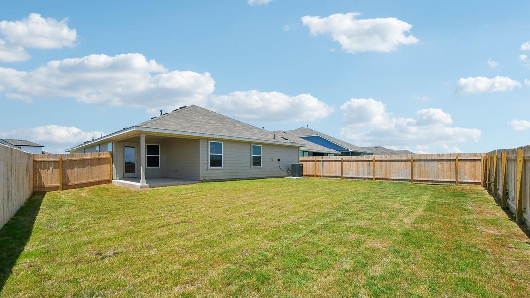 Exterior details and patio area of a home in Carillon, Manor (Image 17).