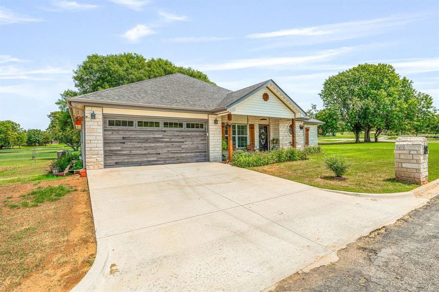 Front exterior of a new home in , Comanche, TX, highlighting curb appeal (Image 22).