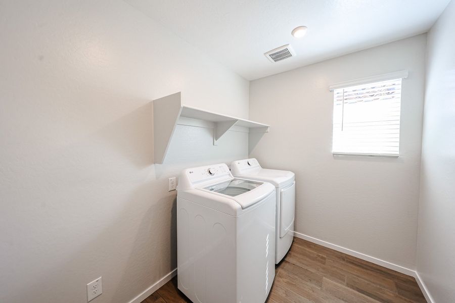 A laundry room with a washer and dryer.