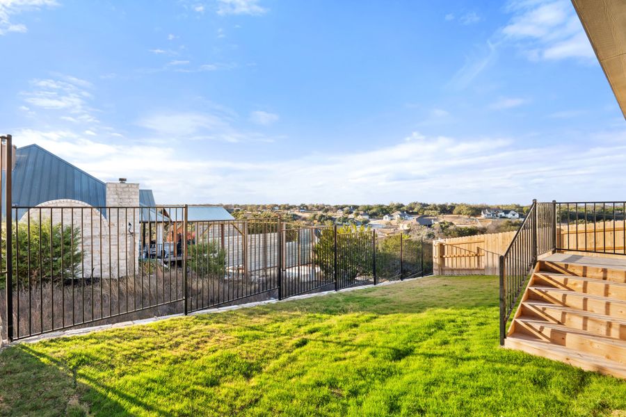 Exterior details and patio area of a home in Lariat, Liberty Hill (Image 27).