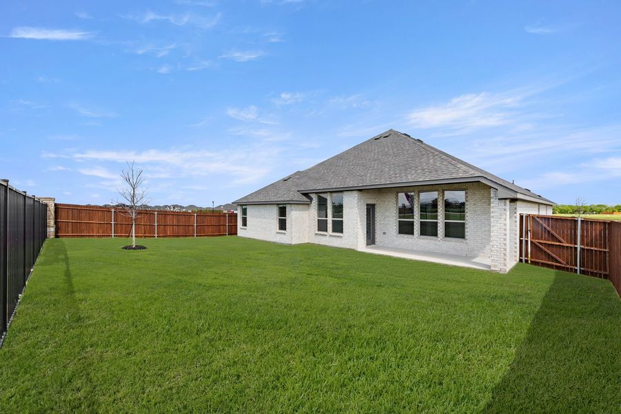 Front exterior of a new home in Timberbrook, Justin, TX, highlighting curb appeal (Image 26). Front exterior of a new home in Timberbrook, Justin, TX, highlighting curb appeal (Image 26).