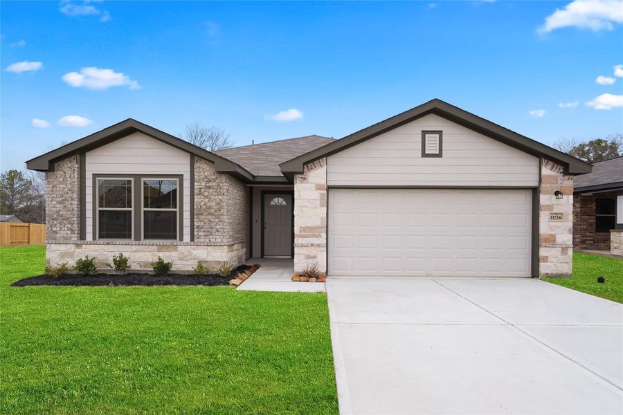 Front exterior of a new home in Lexington Heights, Willis, TX, highlighting curb appeal (Image 13).