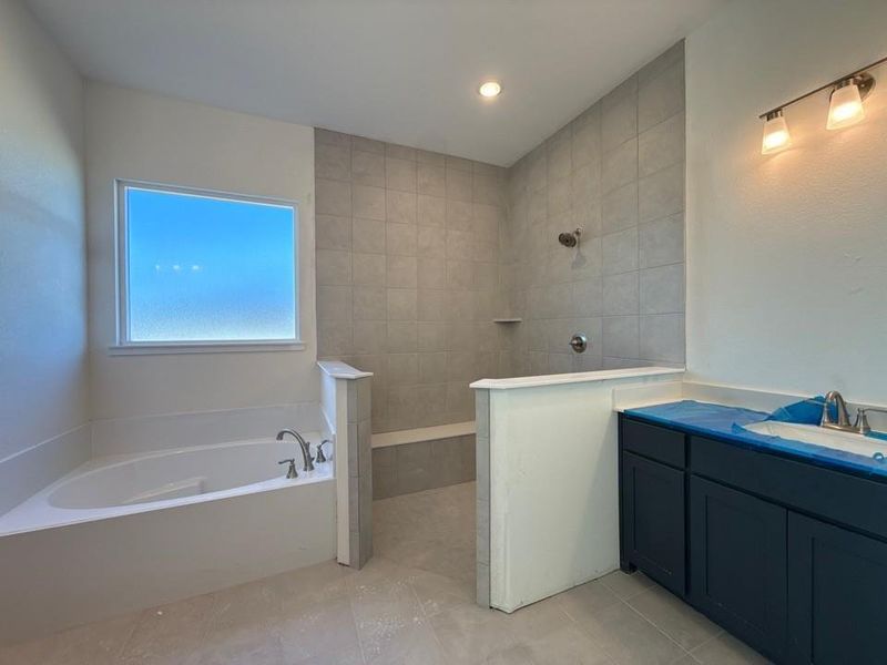 Full bathroom with a bath, a walk in shower, vanity, and recessed lighting