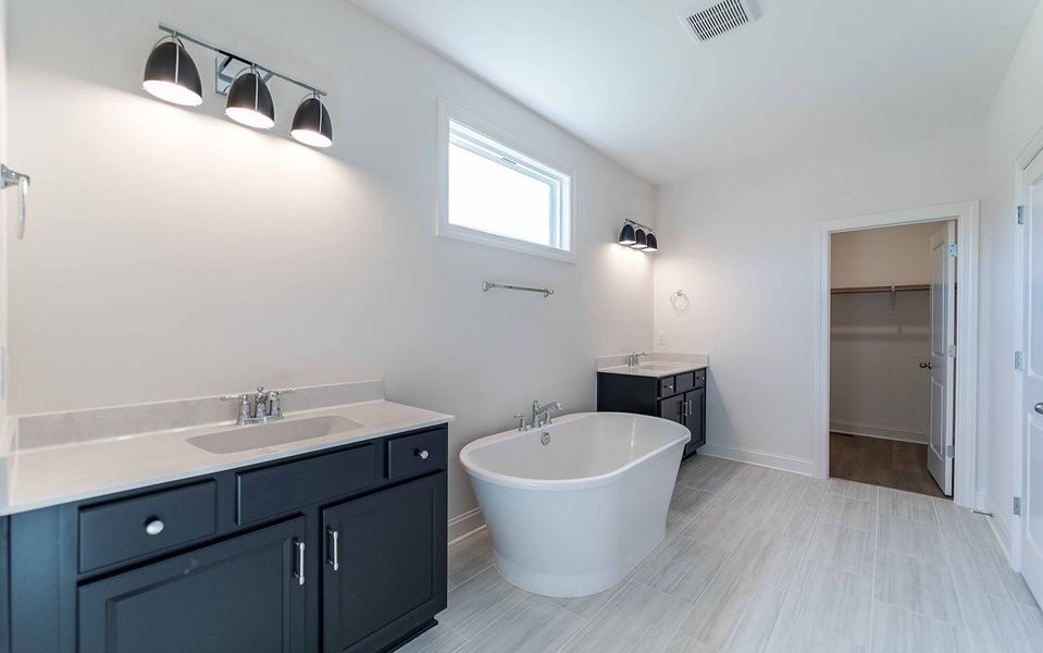 Furnished interior view inside a new home in Aden Woods, Fairview (Image 10).