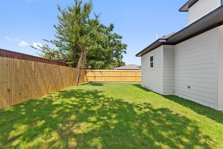 View of fenced backyard