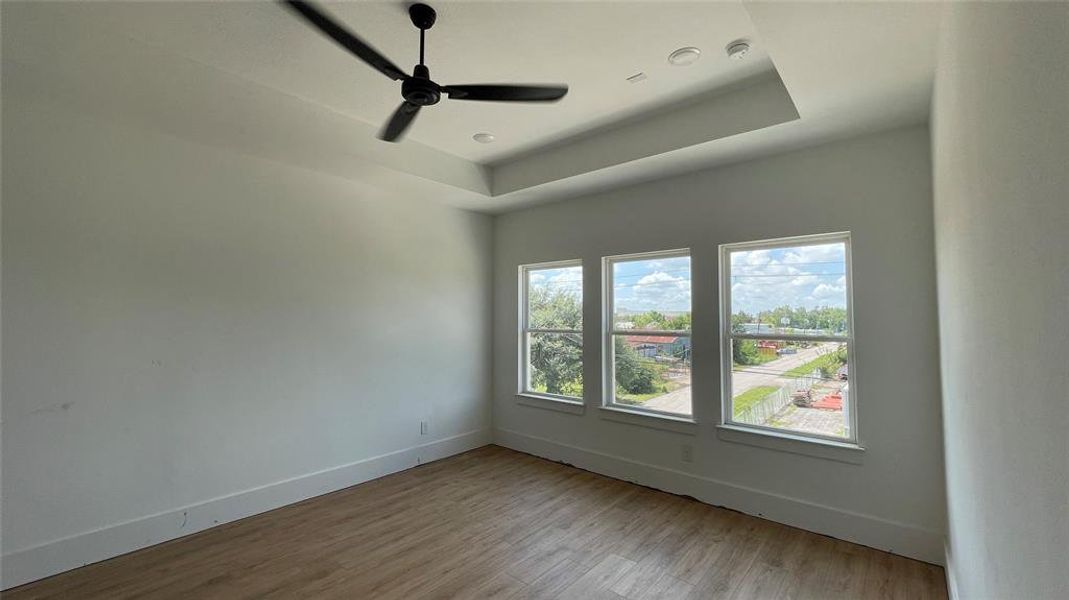 Spacious primary bedroom located on the third floor