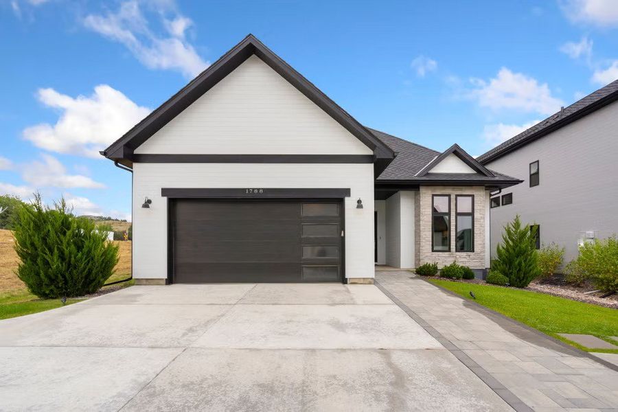 Front exterior of a new home in Pelican Shores at Water Valley, Windsor, CO, highlighting curb appeal (Image 2). Front exterior of a new home in Pelican Shores at Water Valley, Windsor, CO, highlighting curb appeal (Image 2).
