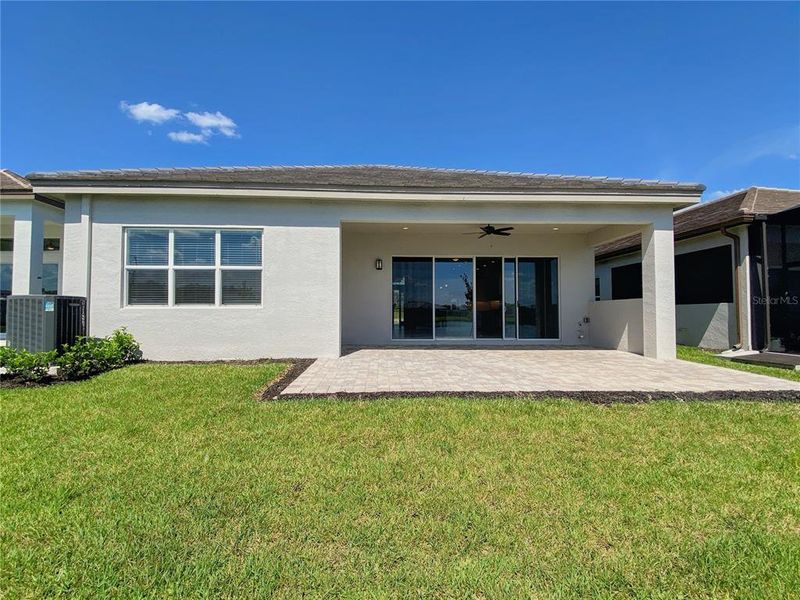 Exterior details and patio area of a home in Valencia Ridge (55+), Wesley Chapel (Image 3).