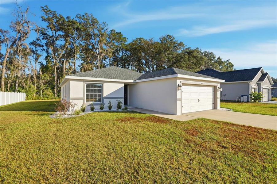 Front exterior of a new home in , Ocala, FL, highlighting curb appeal (Image 1).