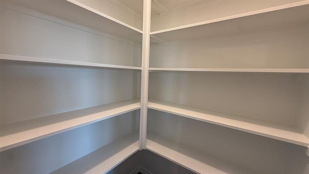 Built-in white shelving system featuring multiple tiers