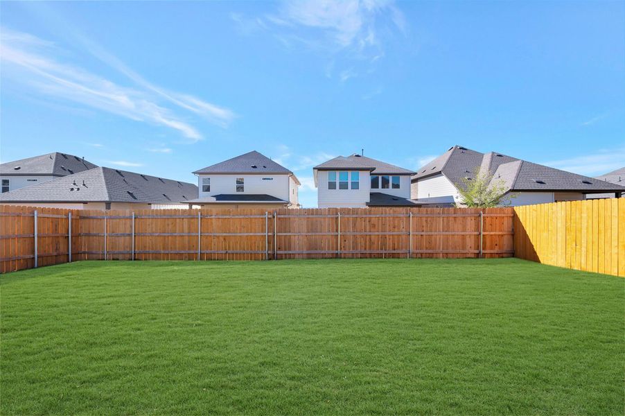Exterior details and patio area of a home in Heritage, Dripping Springs (Image 22).