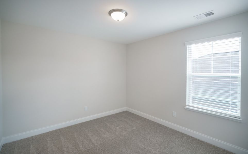 Representative unfurnished interior of a home built from the The McKee by Cothran Homes in Holly Ridge, Greenville (Image 39).