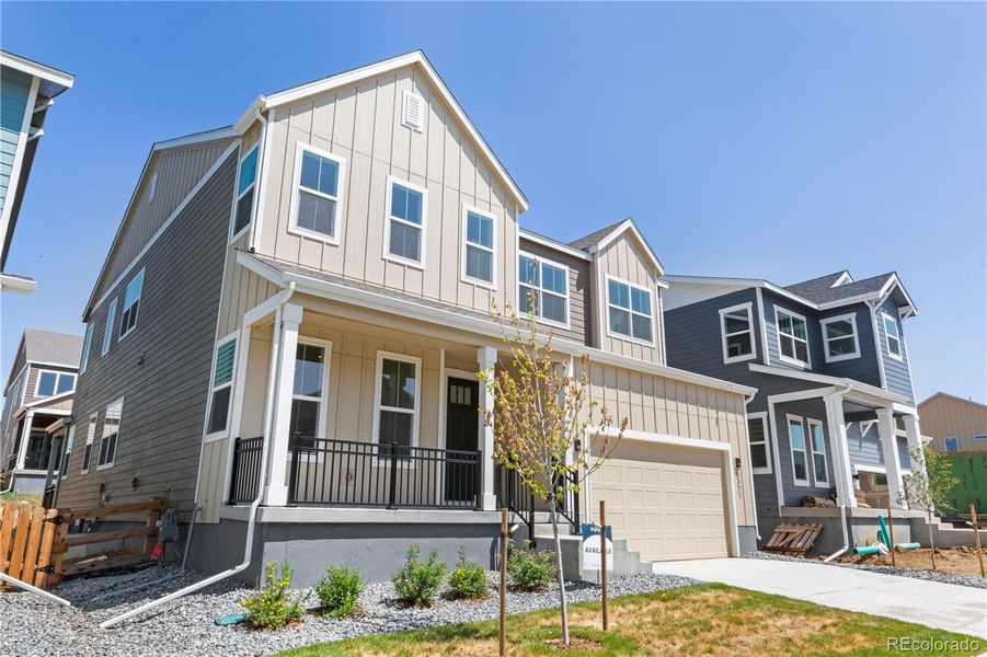Front exterior of a new home in Dillon Pointe - Journey, Broomfield, CO, highlighting curb appeal (Image 19).