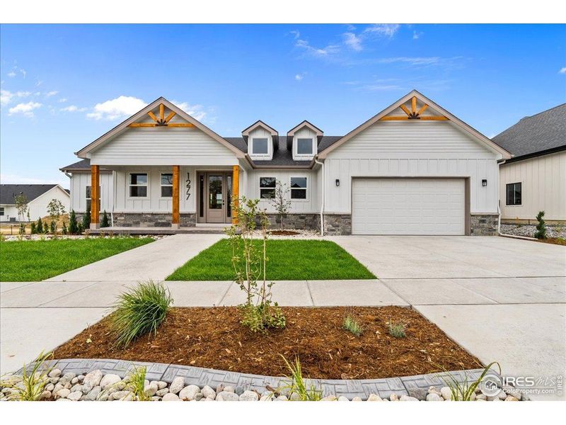 Front exterior of a new home in , Berthoud, CO, highlighting curb appeal (Image 27).