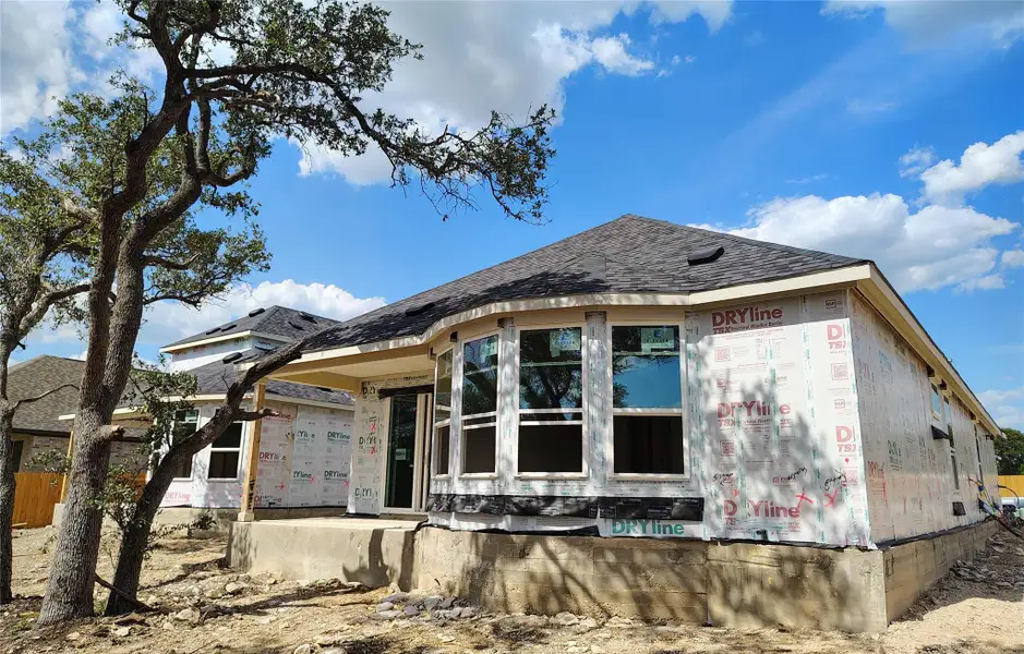 Front exterior of a new home in Woodside, Georgetown, TX, highlighting curb appeal (Image 2). Front exterior of a new home in Woodside, Georgetown, TX, highlighting curb appeal (Image 2).