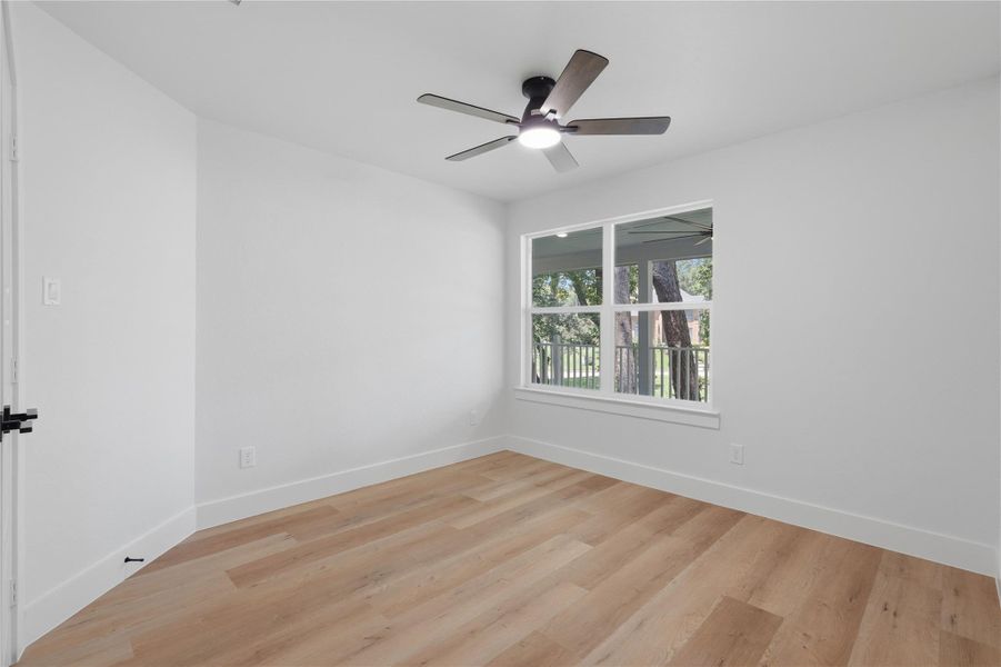 Secondar bedroom upstairs looks out to the backyard and beautiful trees. Secondar bedroom upstairs looks out to the backyard and beautiful trees.