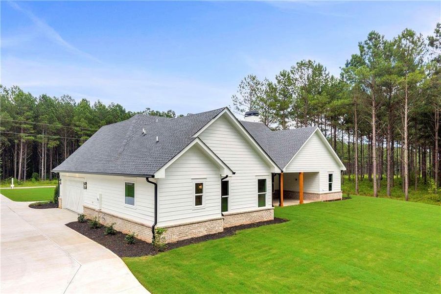 Front exterior of a new home in , Monroe, GA, highlighting curb appeal (Image 31).