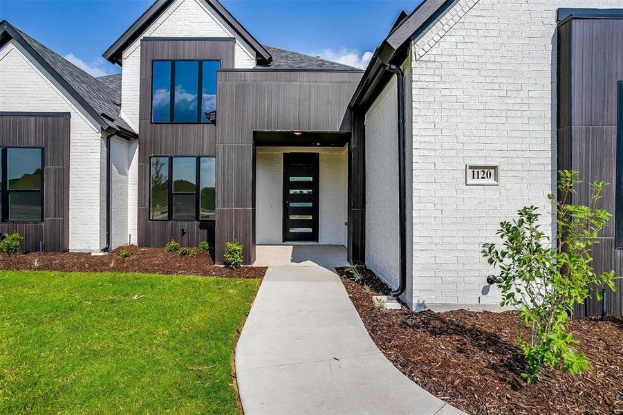 Property entrance featuring a yard