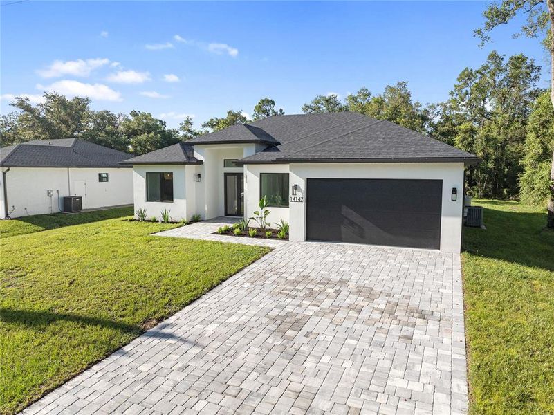 Front exterior of a new home in , Port Charlotte, FL, highlighting curb appeal (Image 1). Front exterior of a new home in , Port Charlotte, FL, highlighting curb appeal (Image 1).