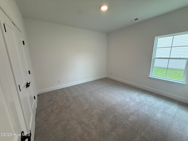 Spacious, unfurnished interior of a new home in Wood Creek Landing, Leland (Image 35). Spacious, unfurnished interior of a new home in Wood Creek Landing, Leland (Image 35).