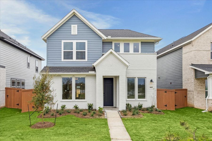 Front exterior of a new home in Elyson, Katy, TX, highlighting curb appeal (Image 1). Front exterior of a new home in Elyson, Katy, TX, highlighting curb appeal (Image 1).