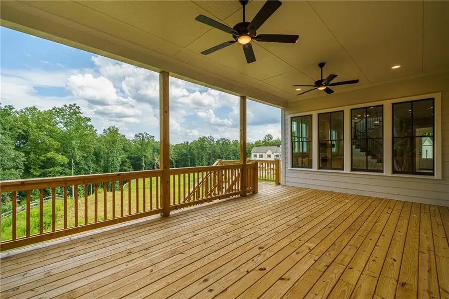 Exterior details and patio area of a home in Malone's Pond, Ball Ground (Image 4).