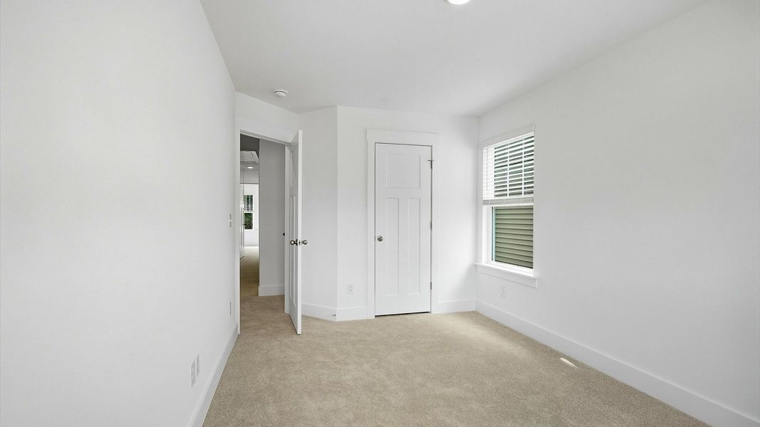 Elegant bedroom retreat featuring soft carpeting and a thoughtfully designed walk-in closet in Spartanburg, SC Elegant bedroom retreat featuring soft carpeting and a thoughtfully designed walk-in closet in Spartanburg, SC