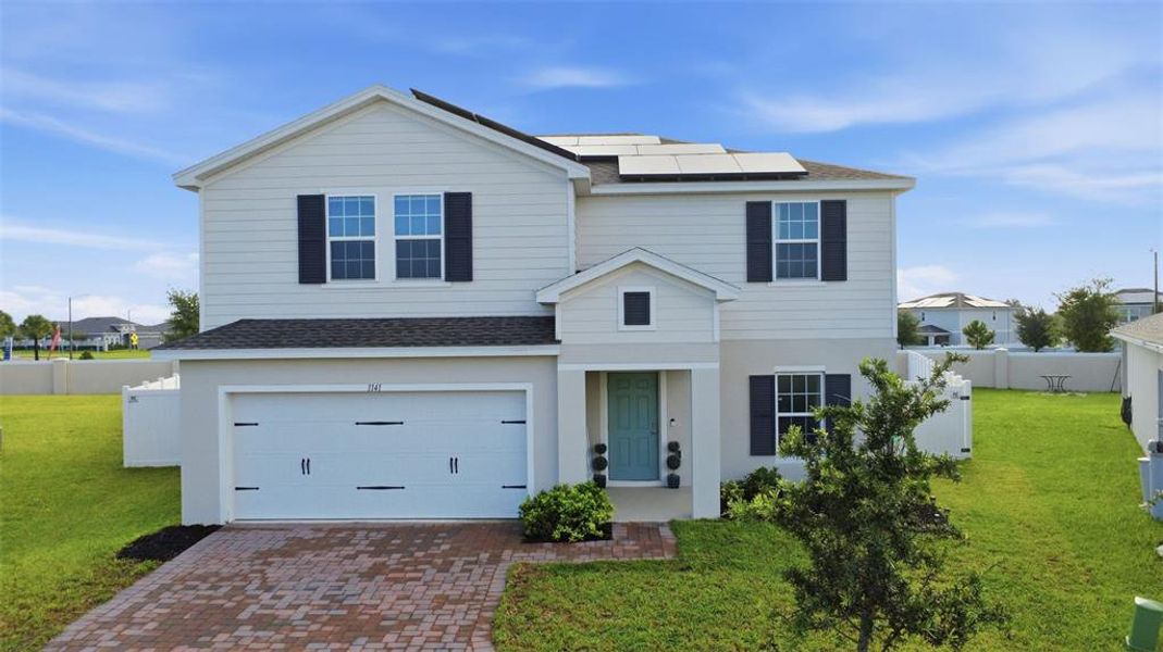 Front exterior of a new home in , Haines City, FL, highlighting curb appeal (Image 28). Front exterior of a new home in , Haines City, FL, highlighting curb appeal (Image 28).