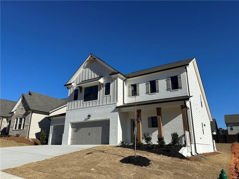 Front exterior of a new home in Summerlin, Winder, GA, highlighting curb appeal (Image 2). Front exterior of a new home in Summerlin, Winder, GA, highlighting curb appeal (Image 2).