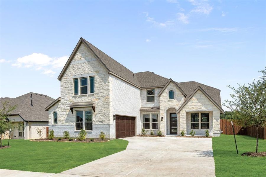 Front exterior of a new home in Trees Farm, DeSoto, TX, highlighting curb appeal (Image 24). Front exterior of a new home in Trees Farm, DeSoto, TX, highlighting curb appeal (Image 24).