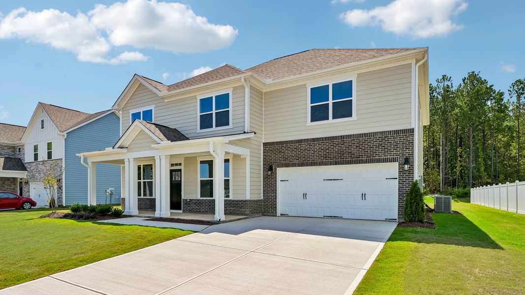 Representative exterior photo of a completed home built from the Tillery by D.R. Horton in Eagle Creek, Fuquay Varina, NC (Image 2). Representative exterior photo of a completed home built from the Tillery by D.R. Horton in Eagle Creek, Fuquay Varina, NC (Image 2).