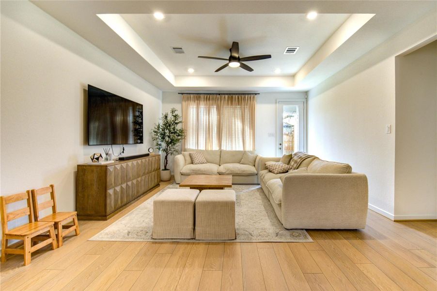 Expansive main living room offers a welcoming refined space where guests can relax and enjoy meaningful conversations in a cultivated inviting atmosphere.